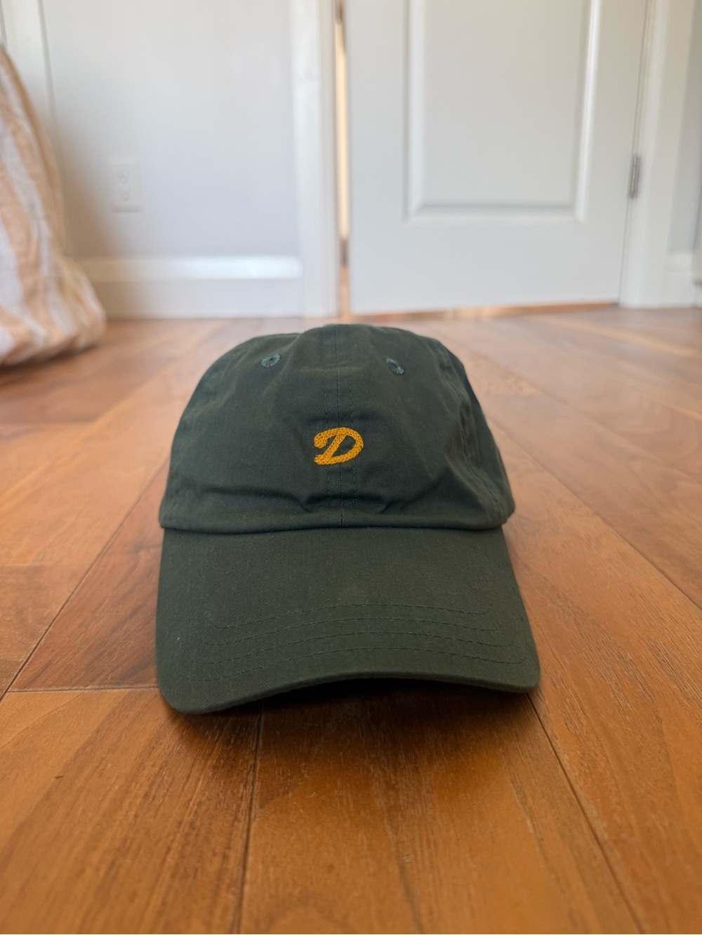 Drake’s Dark Green Dad Hat with Yellow Embroidered D